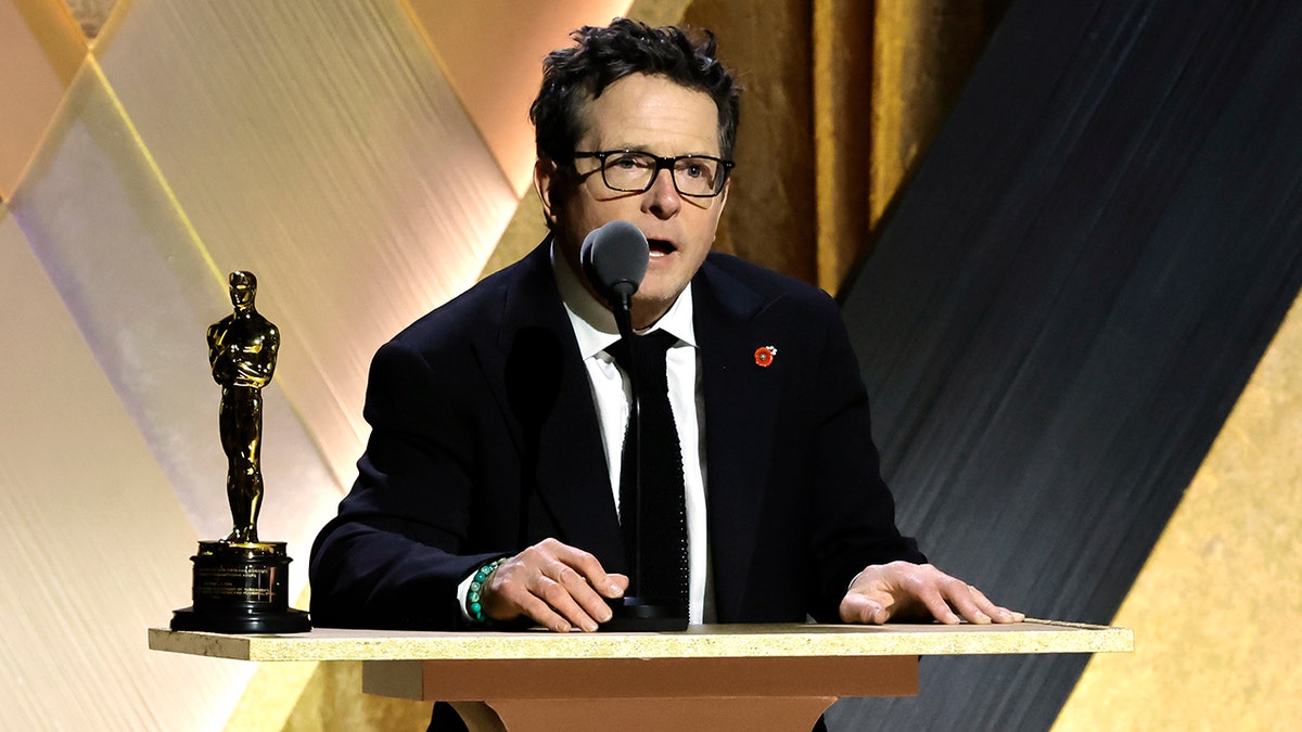 Michael J. Fox gives a speech at the podium at the Governors Award