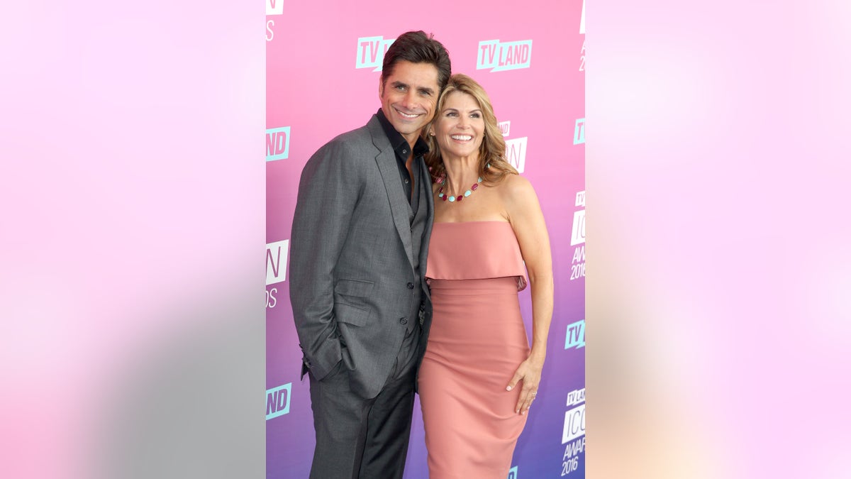 John Stamos and Lori Loughlin on red carpet