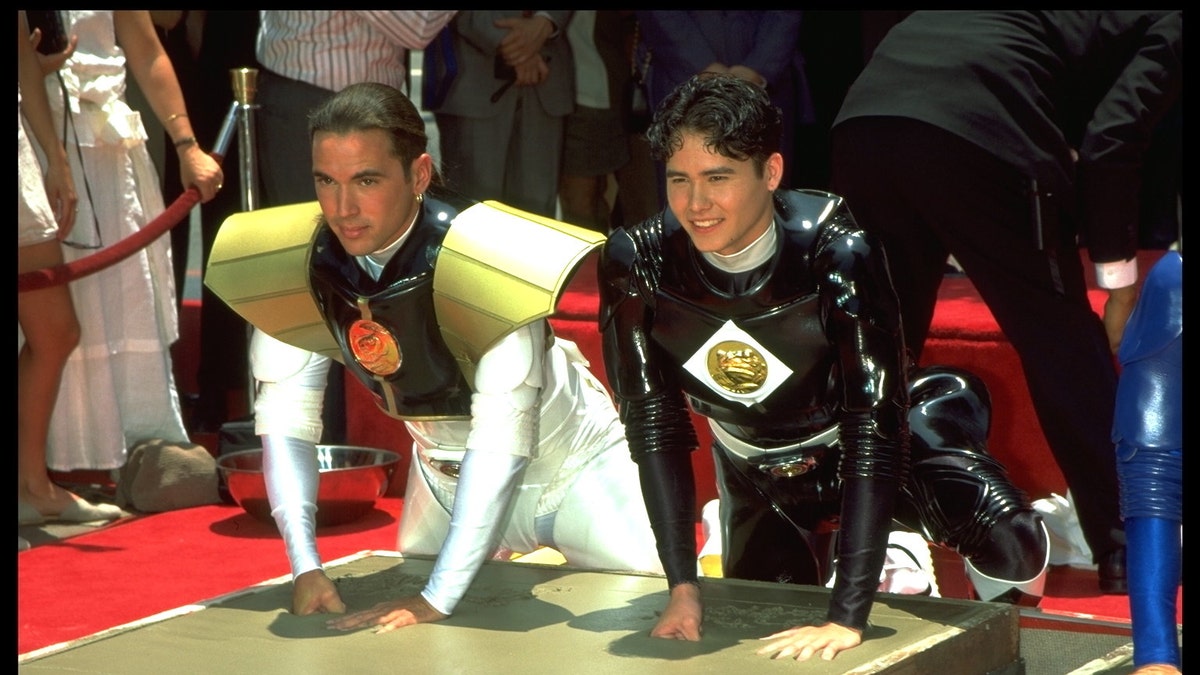 Jason David Frank and Johnny Yong Bosch in their "Power Rangers" uniform