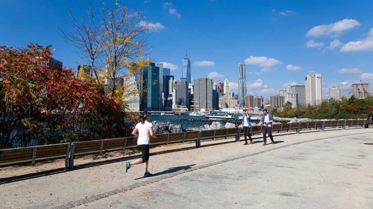 Woman jogging in NYC pier
