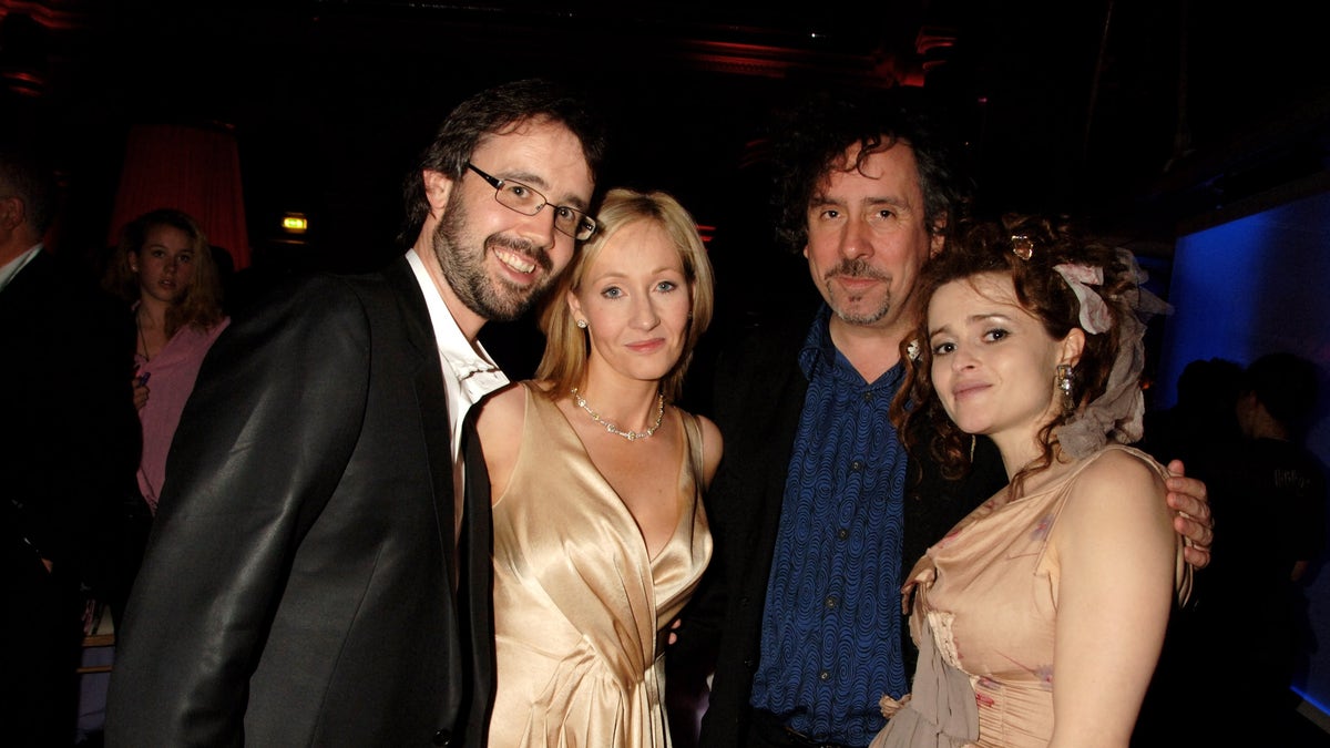 J.K. Rowling and her husband Neil Murray pose for a photo with Tim Burton and his now ex-wife Helena Bonham Carter in 2007.