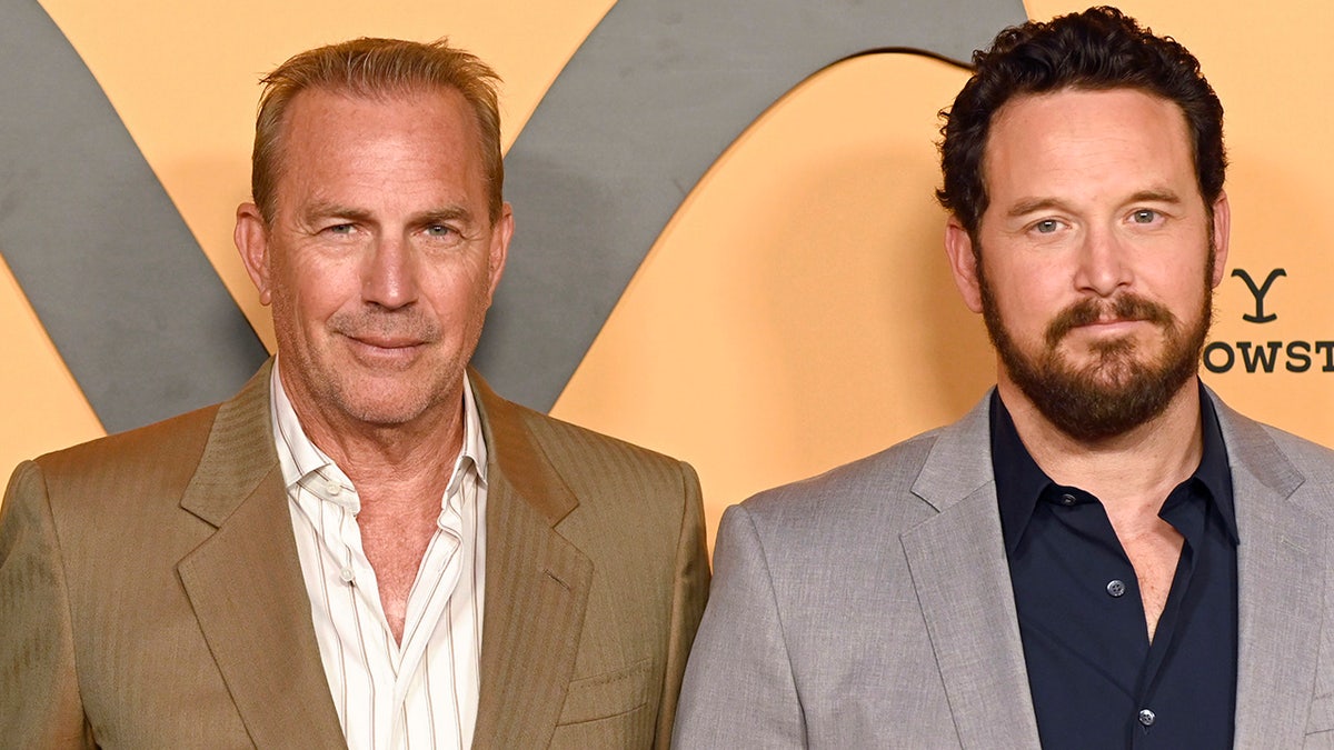 Kevin Costner and Cole Hauser at a press event smiling