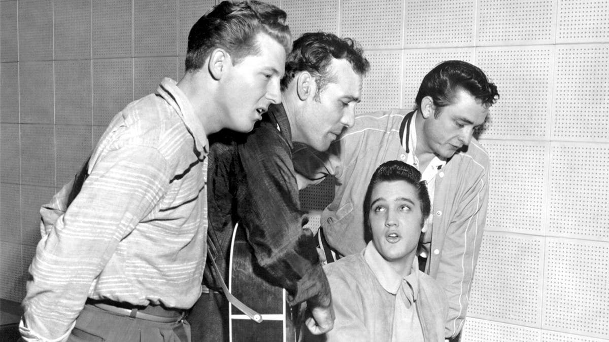 Johnny Cash singing with Elvis Presley