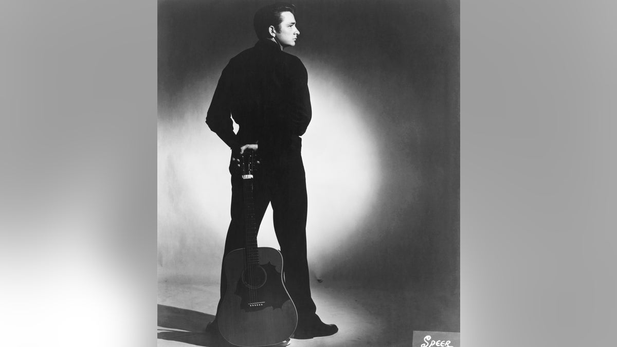 Johnny Cash posing as the Man in Black