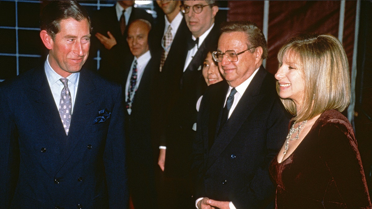 Prince Charles smiling at Barbra Streisand
