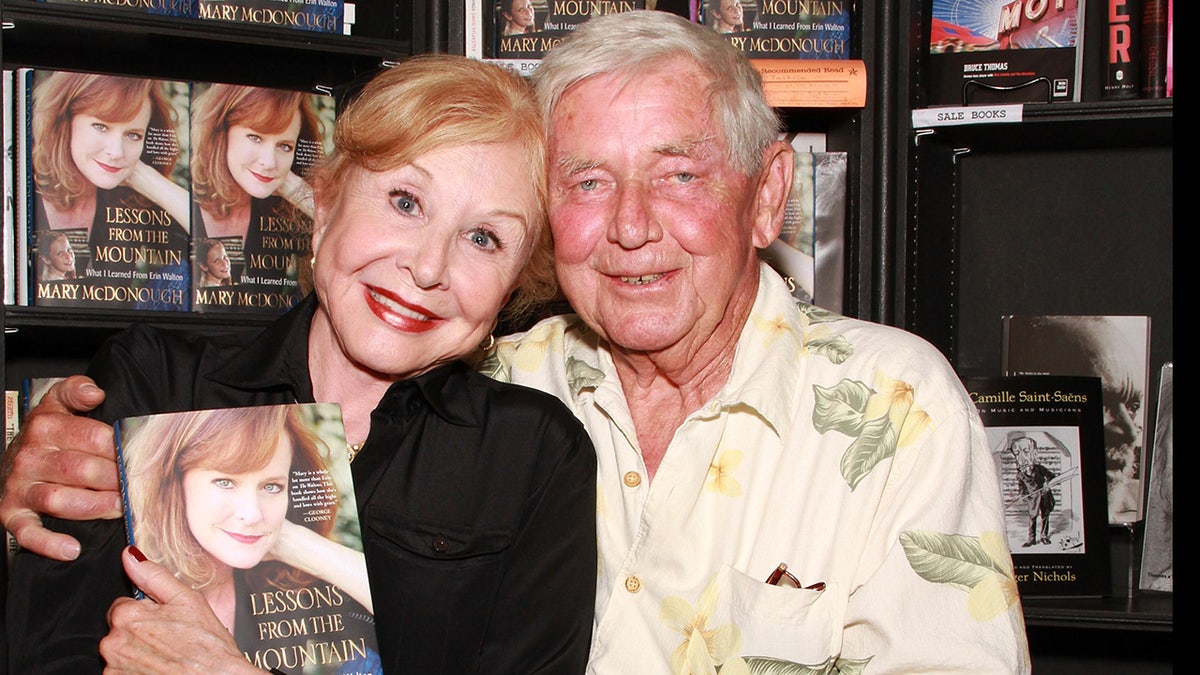 Actors Michael Learned and Ralph Waite attend the signing of Mary McDonough's book