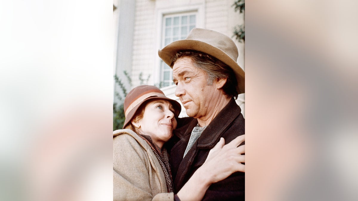 Actress Michael Learned embraces actor Ralph Waite