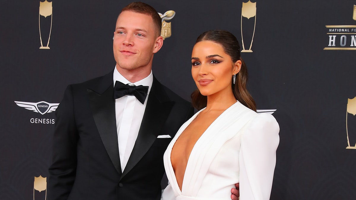 Christian McCaffrey and Olivia Culpo on the red carpet.