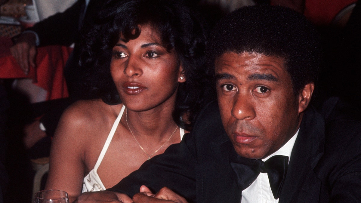 Pam Grier and Richard Pryor having dinner together.