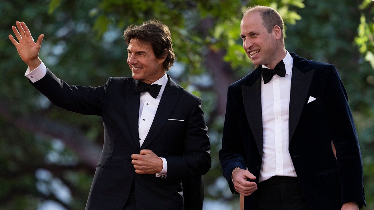 Prince William and Tom Cruise waving to the public