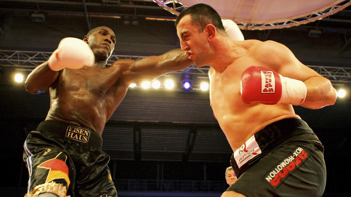 Boxer Pedro Carrion of Germany punches Goran Gogic during bout