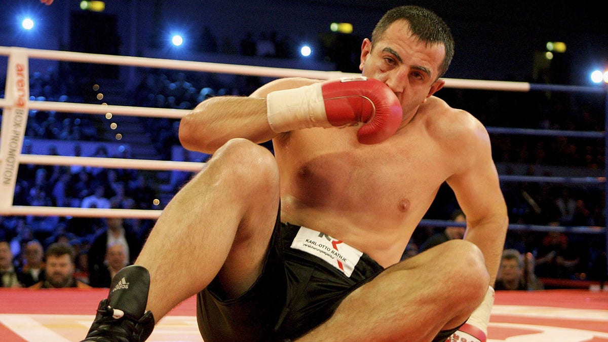 Boxer on the floor during heavyweight fight