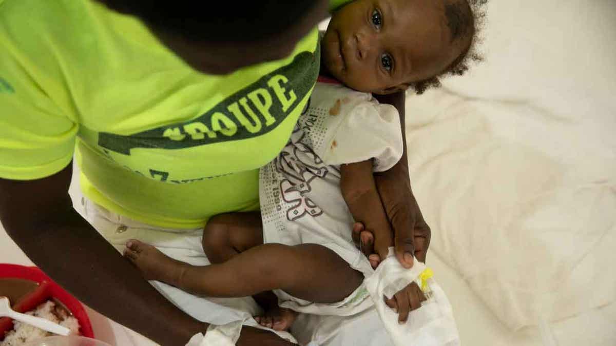 Baby with cholera in Haiti