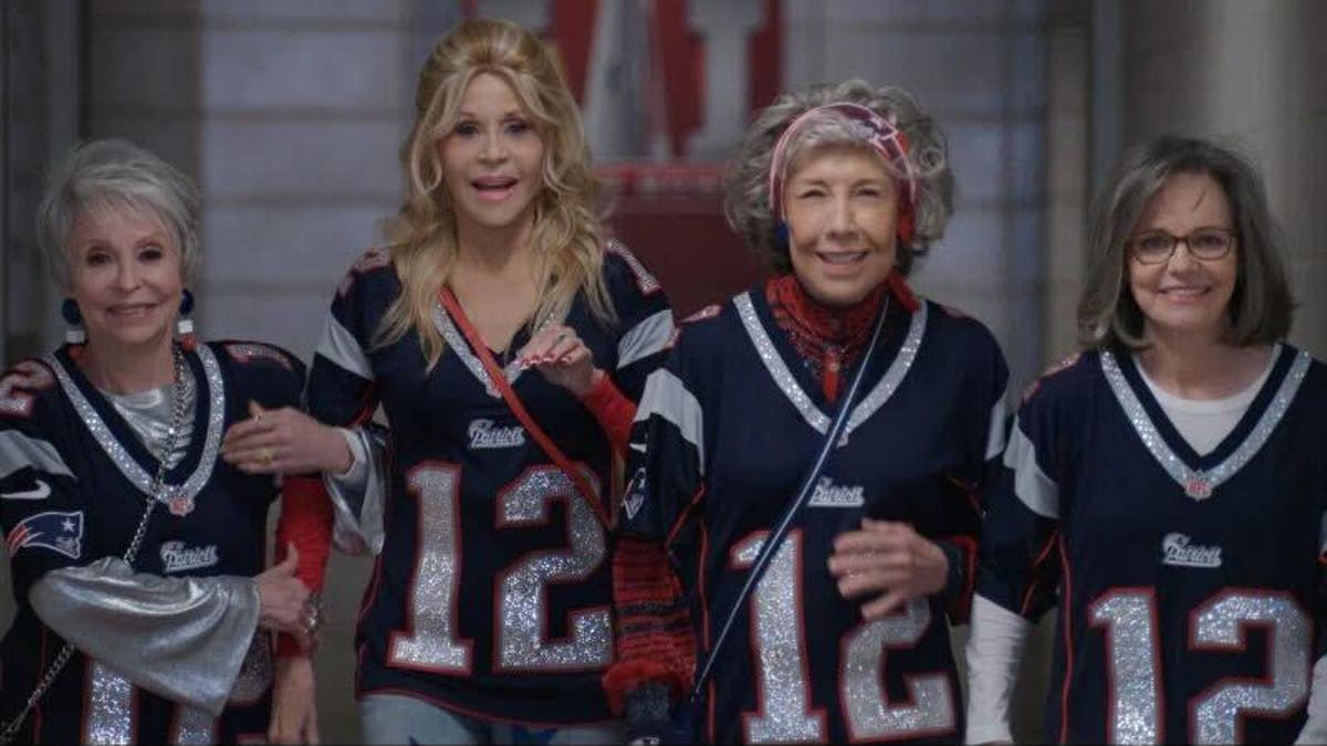 Rita Moreno, Jane Fonda, Lily Tomlin, and Sally Field all wear Tom Brady jerseys in a shot from the film "80 for Brady"