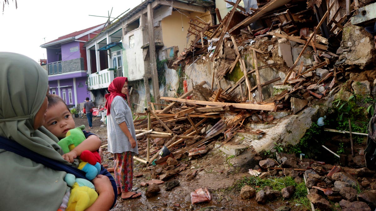 Woman looking at destruction