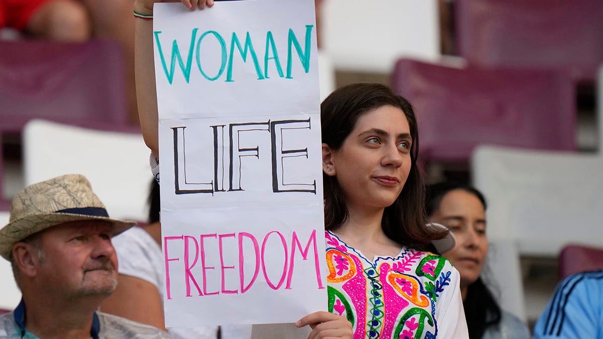 Woman shows support for Iranian protesters