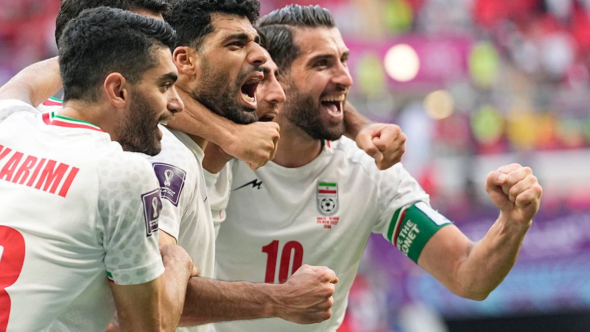 Iran players celebrate