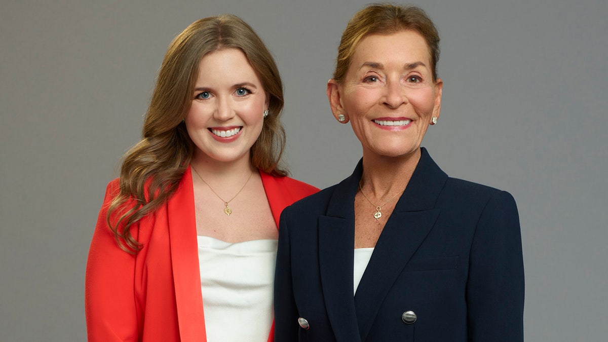 Sarah Levy and Judge Judy smiling as they film Judy Justice