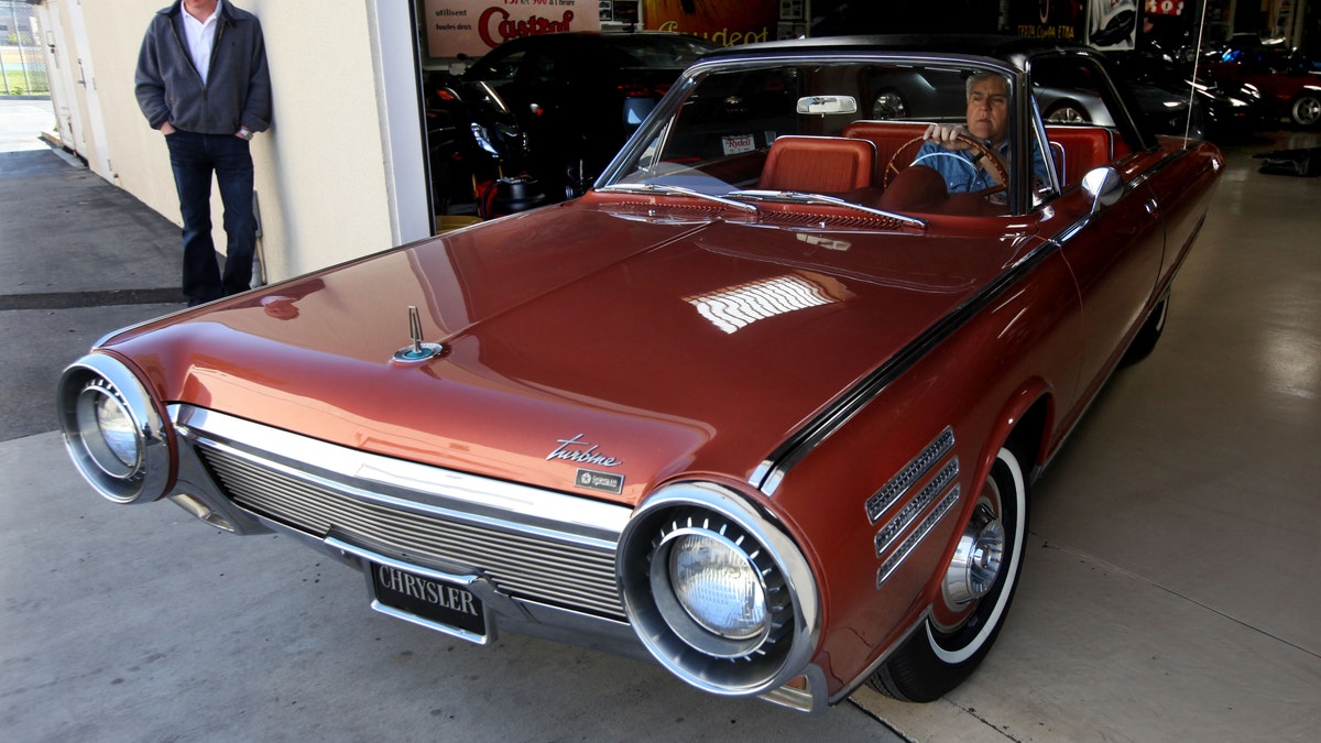 Jay Leno drives a classic car in Burbank