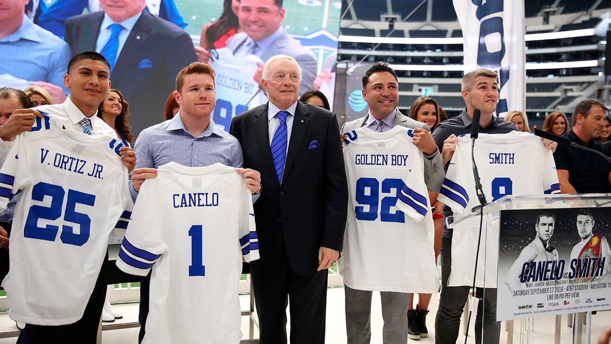 Jerry Jones poses for a picture during a press conference