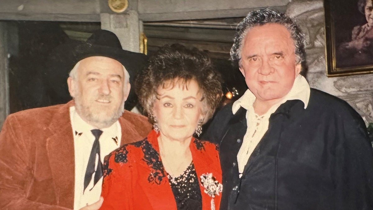 Joanne and Johnny Cash posing for a photo
