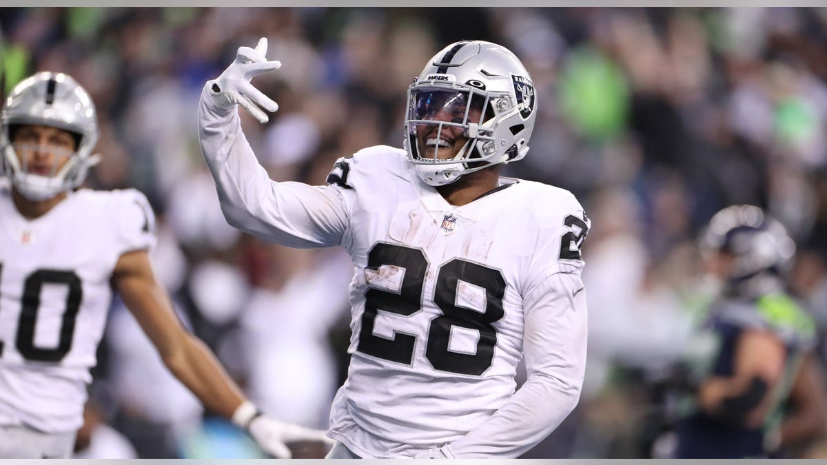 Josh Jacobs celebrates touchdown