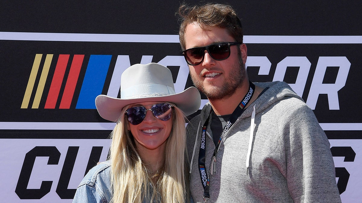 Matthew and Kelly Stafford at a NASCAR race