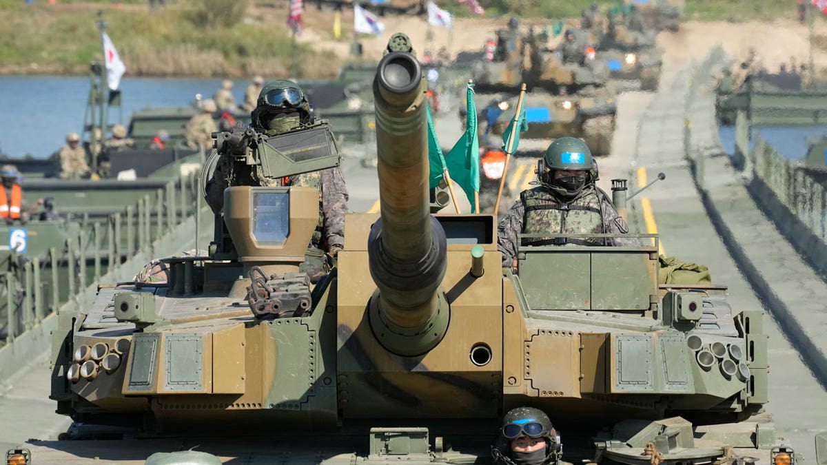 South Korean tanks cross a floating bridge in river-crossing drill with the US