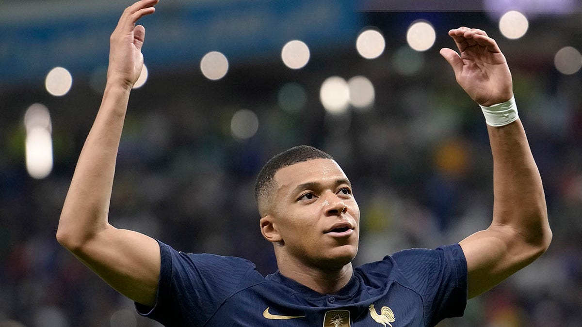 Kylian Mbappe plays to the crowd