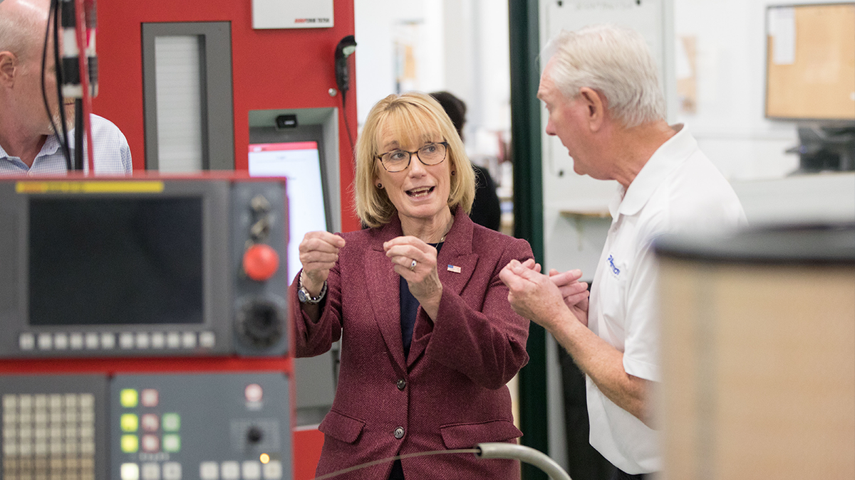 Maggie Hassan touring a local business