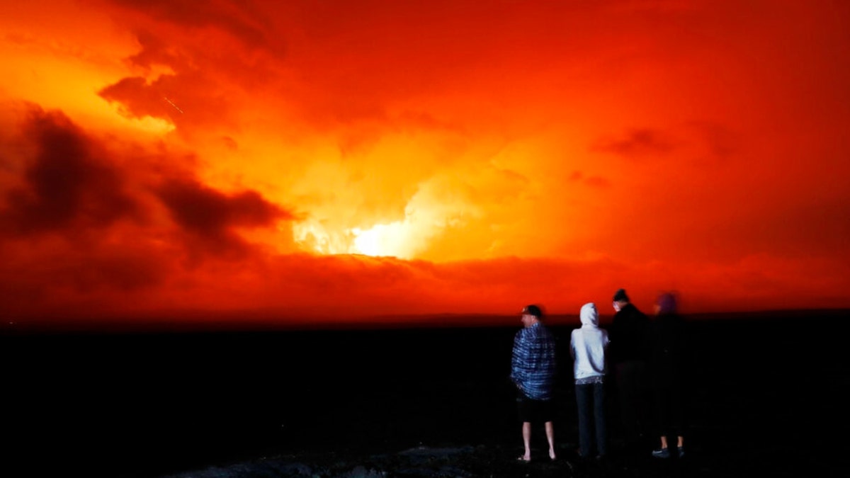 Mauna Loa red skies of eruption with people watching