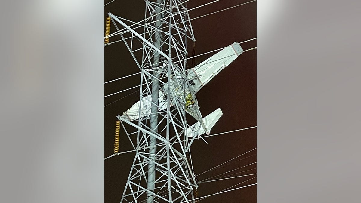 Plane stuck in powerlines