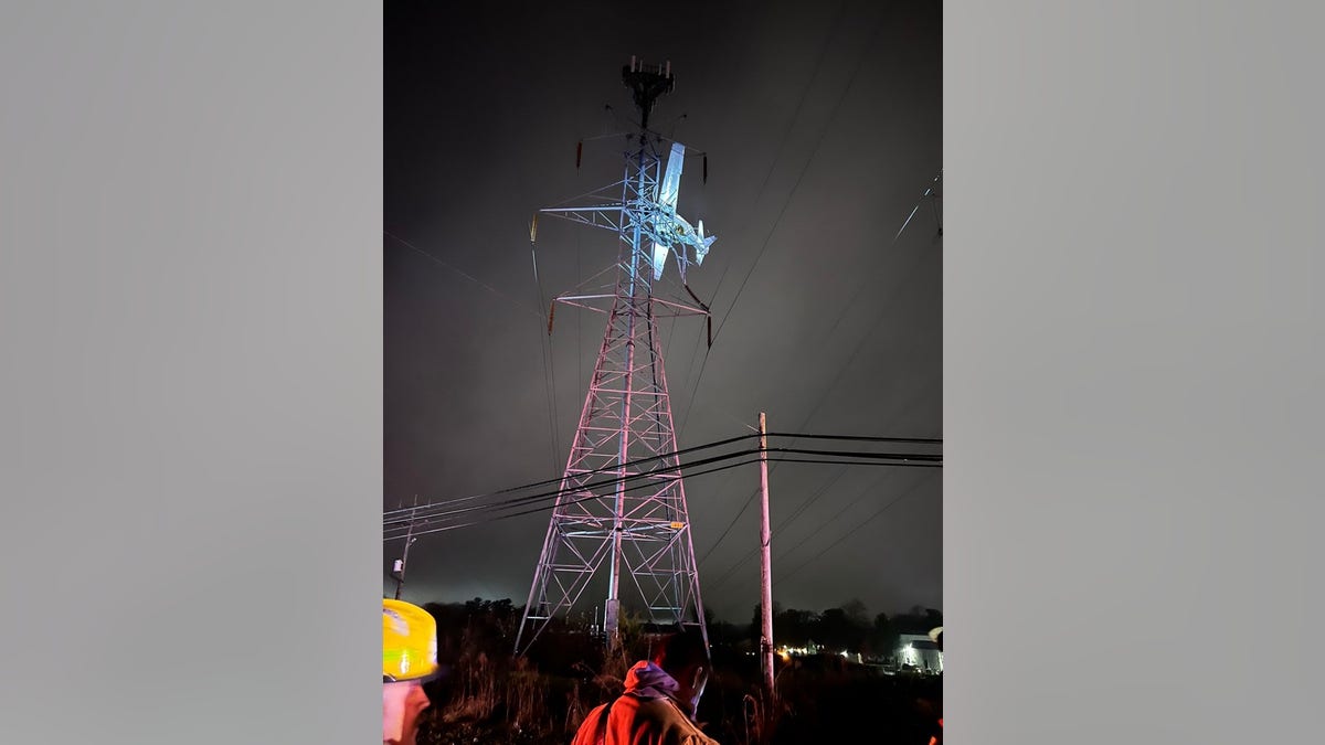 Plane stuck in power lines