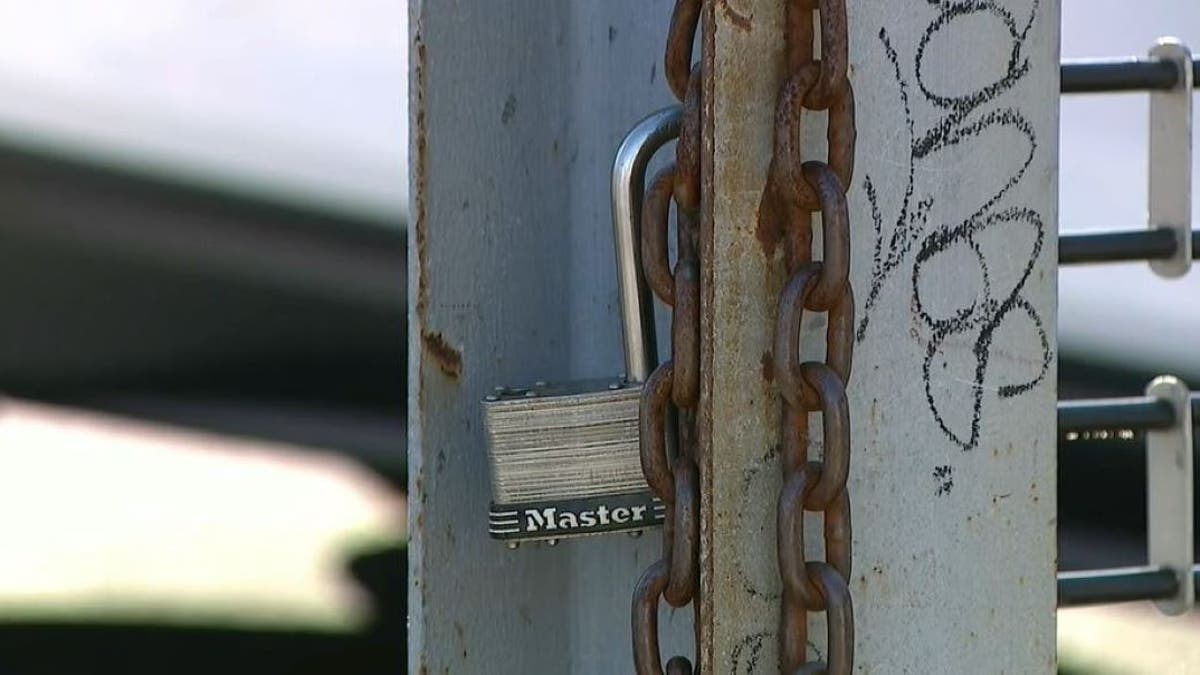 Photo of broken lock at car dealership