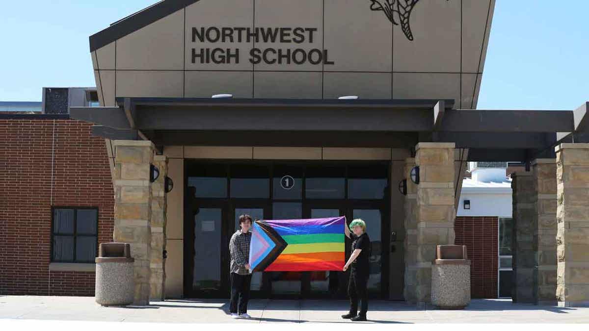 Two students with pride flag at Northwest High School