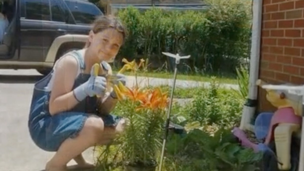 Olivia Daryl Taylor appears to be gardening at her family's Tennessee home.