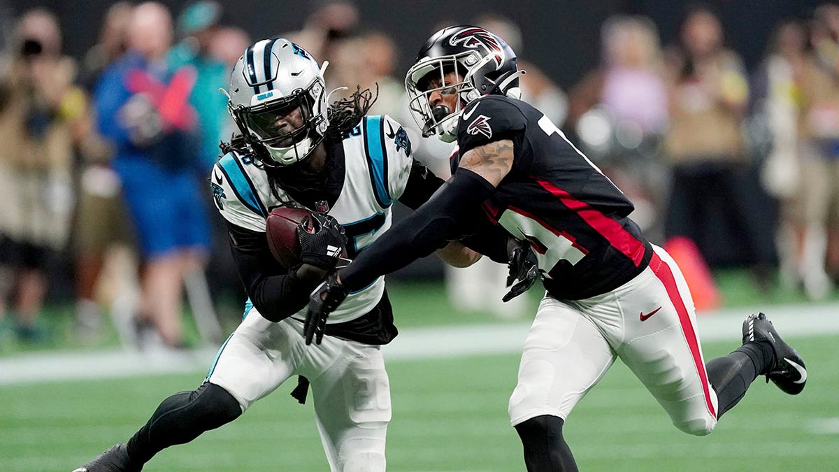 Donte Jackson intercepts a pass