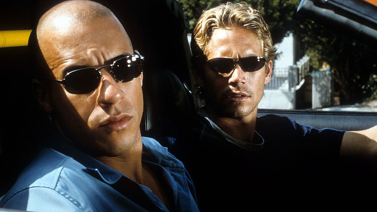 Paul Walker drives Vin Diesel in Fast and Furious