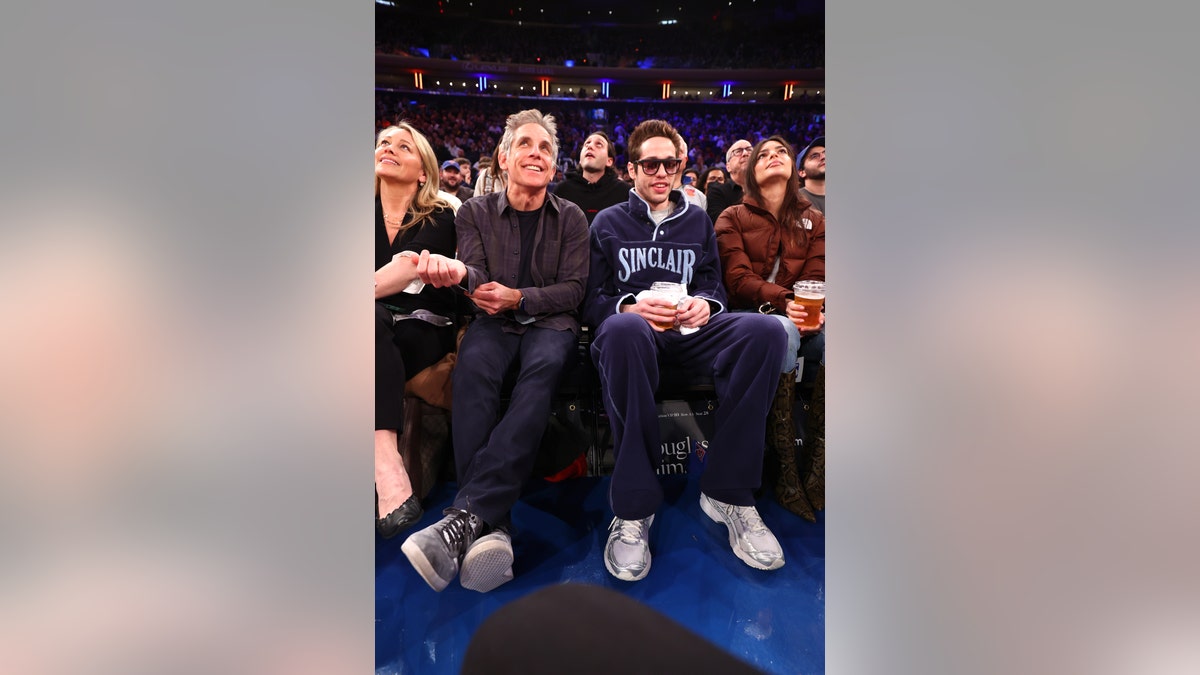 Pete Davidson wears jeans and sweater at Knicks game with Emily Ratajkowski