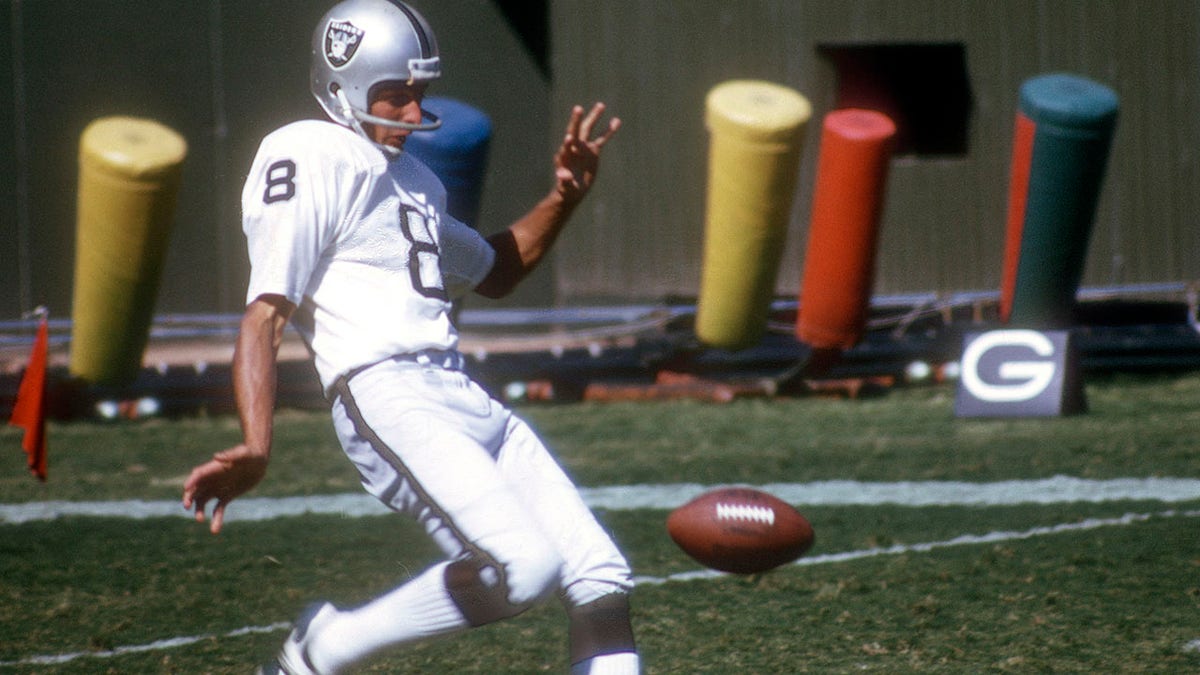 Ray Guy punts for the Raiders