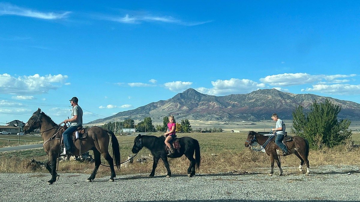 Shane Adams riding Mongo with kids