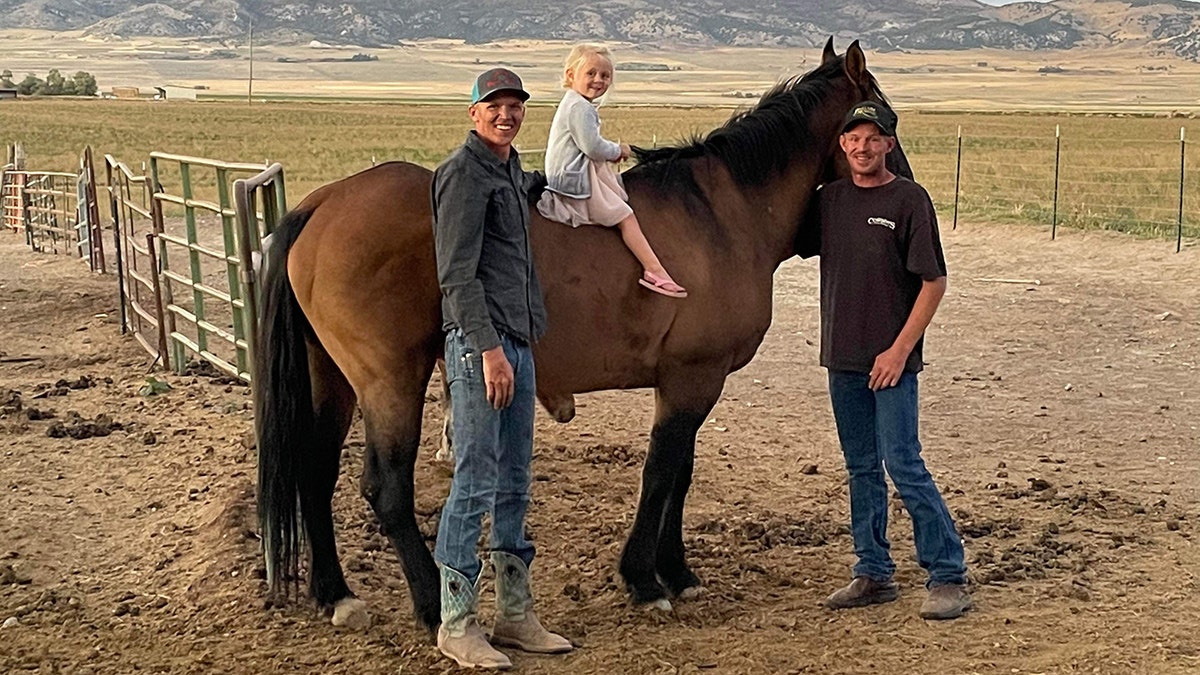 Shane Adams with Mongo and family