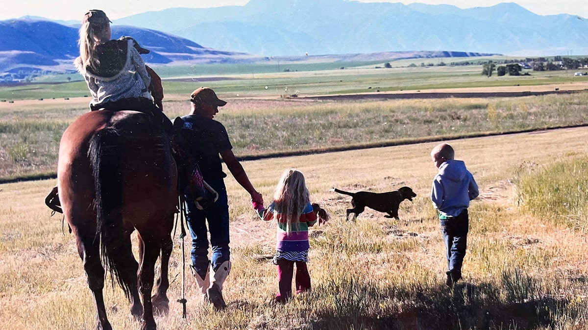 Shane Adams leading Mongo with kids