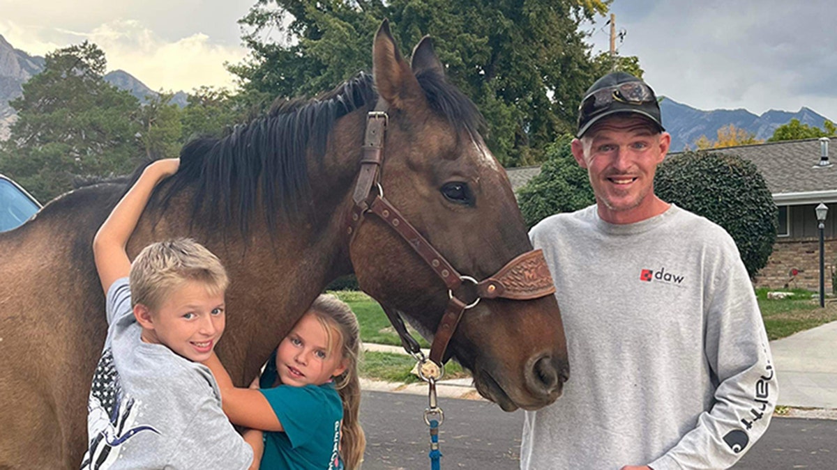 Shane Adams with kids and Mongo