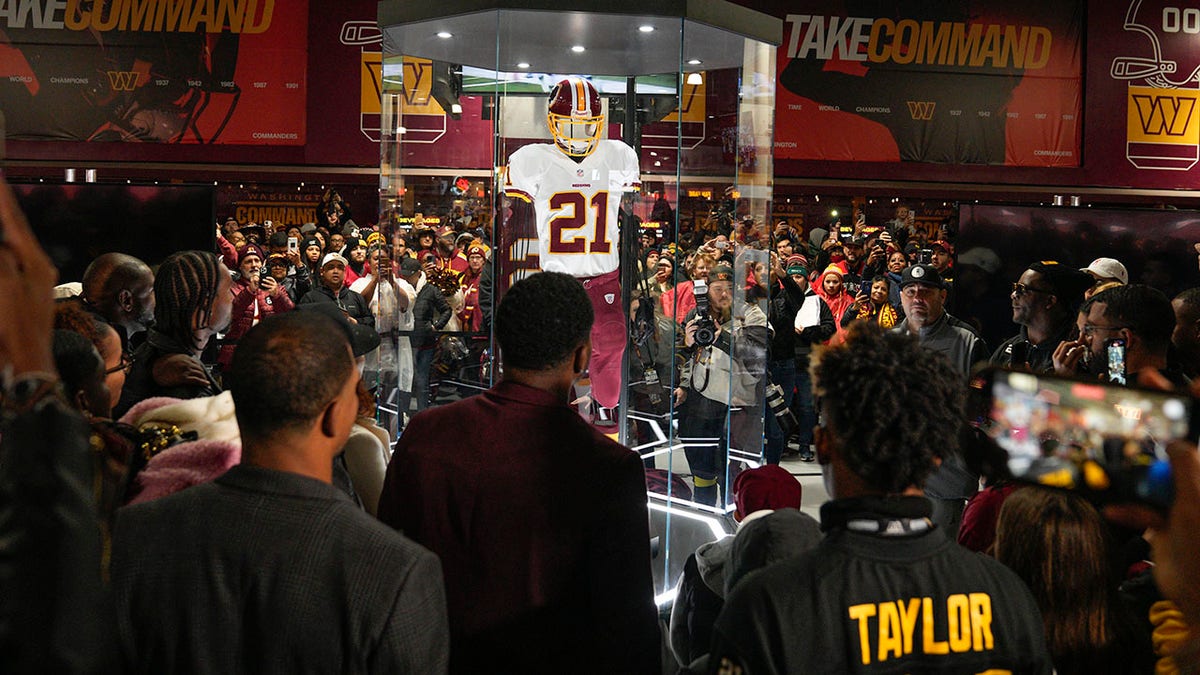 Fans attends the unveiling of the Sean Taylor Memorial, before the start of an NFL football game between the Atlanta Falcons and Washington Commanders, Sunday, Nov. 27, 2022, in Landover, Maryland.