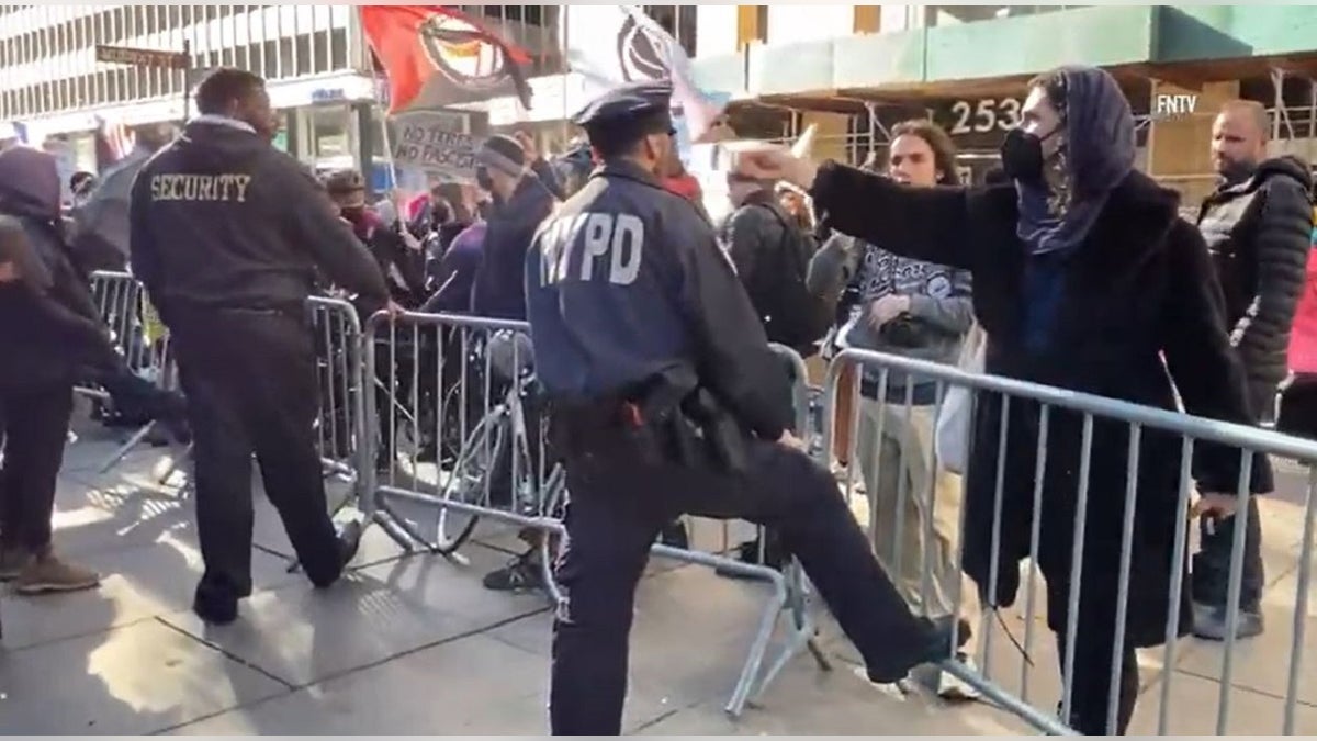 NYC transgender rights demonstrators rings bell