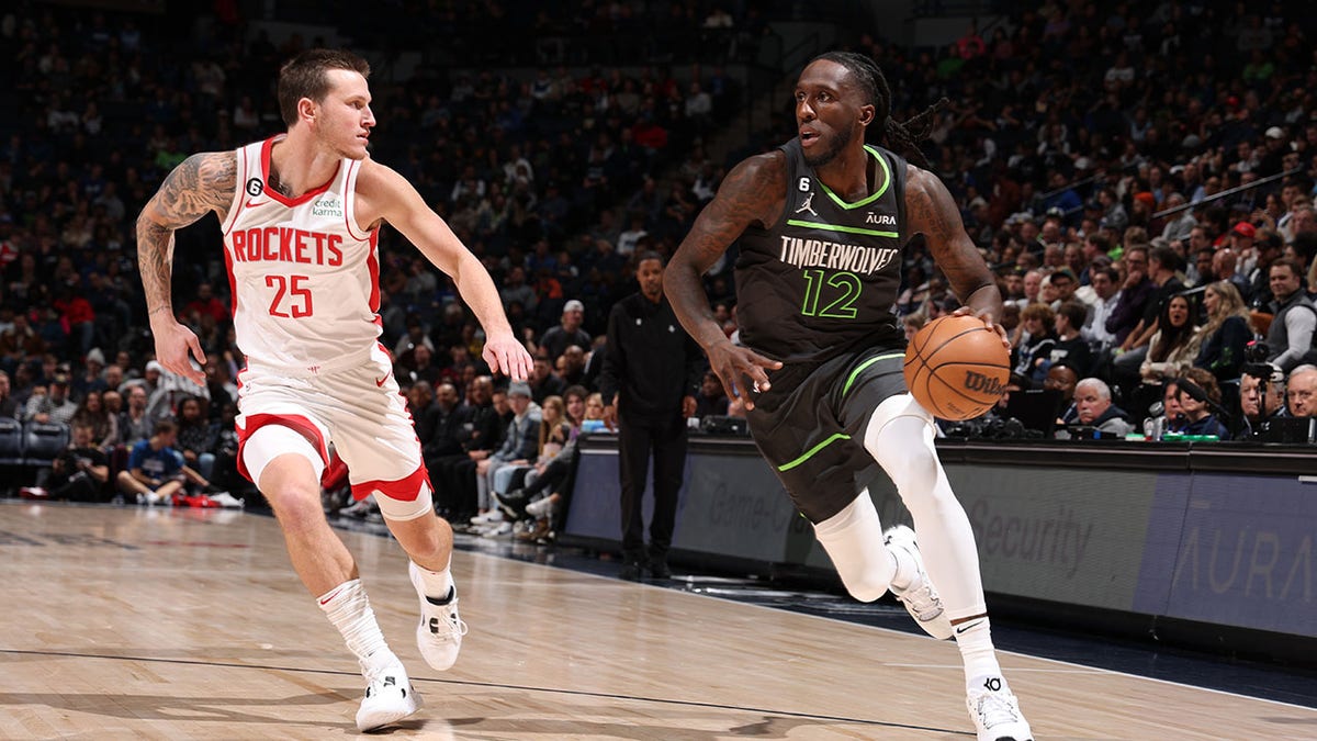 Timberwolves player dribbles the basketball