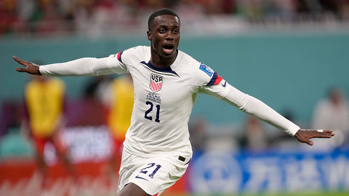 Tim Weah celebrates