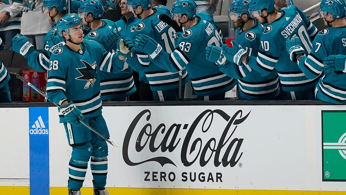 Timo Meier shakes hands with teammates