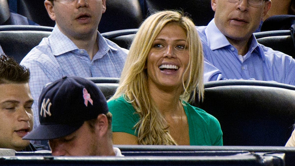 Torrie Wilson watches the Yankees